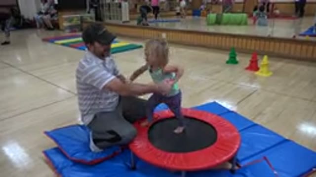 WESTMINSTER COLORADO-2016: Girl Wearing Purple Pants Jumps On Red And Black Trampoline