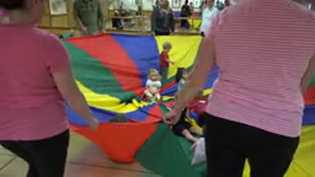 WESTMINSTER COLORADO-2016: Kids Sitting In The Middle Of A Rainbow Parachute