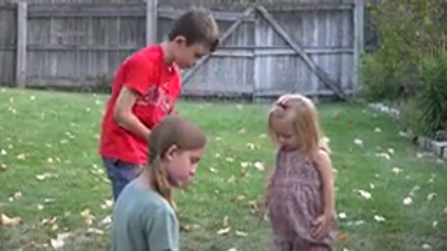 WESTMINSTER COLORADO-2016: Kids Playing In A Fenced Backyard With Leaves On The Ground