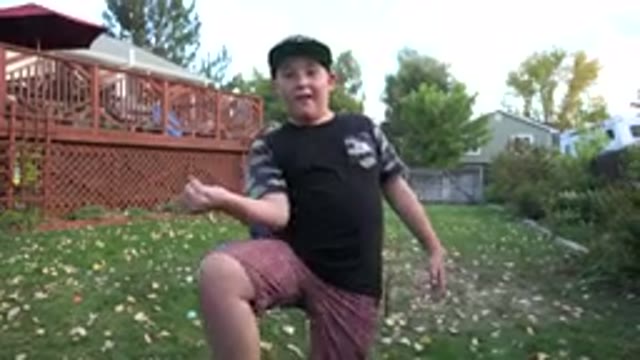 WESTMINSTER COLORADO-2016: Young Boy Dancing in the Backyard