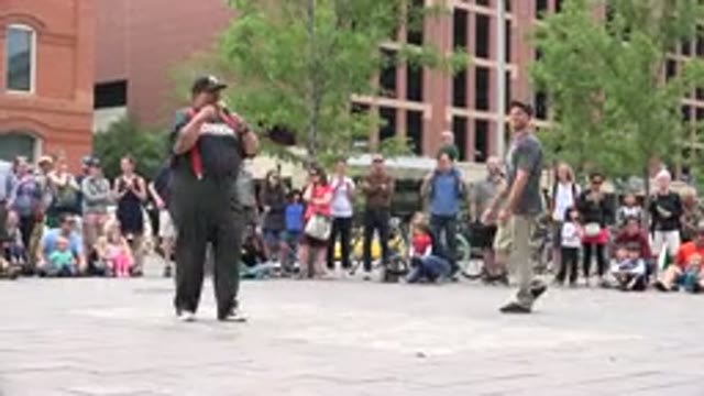 GRAND JUNCTION COLORADO-2017: Two Street Performers Warming Up For Their Routine