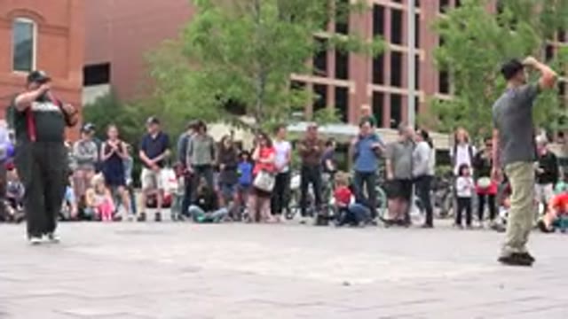 GRAND JUNCTION COLORADO-2017: People Standing In A Circle At A Plaza Watching