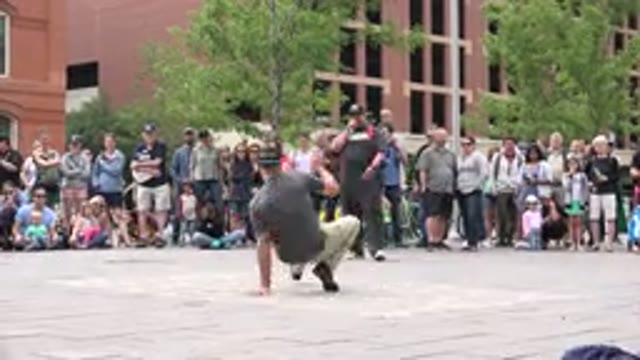 GRAND JUNCTION COLORADO-2017: A Man Break Dancing In An Opening In The Middle Of