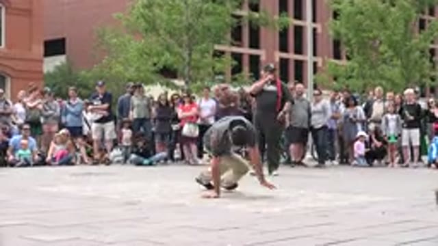 GRAND JUNCTION COLORADO-2017: Person Wearing Grey Shirt Break Dances For Crowd