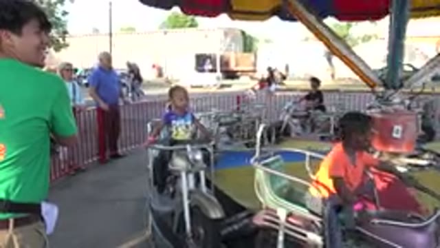 GRAND JUNCTION COLORADO-2017: Kids Riding Scooters On A Clear Day