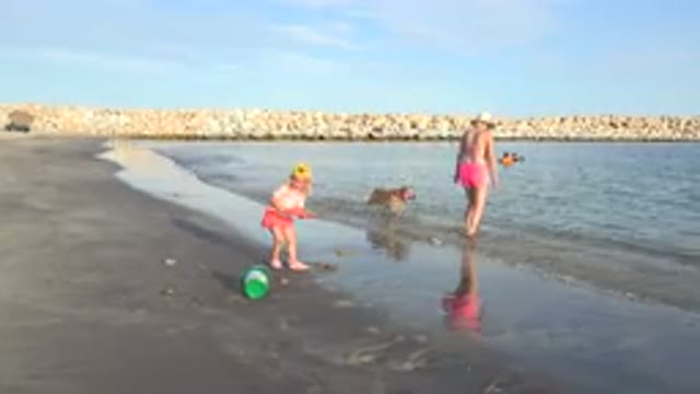 GRAND JUNCTION COLORADO-2017: A Family's Day Out At The Beach With A Child Playing In Sand