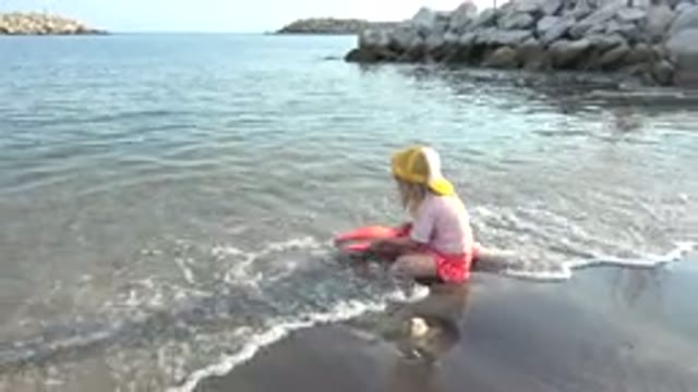 GRAND JUNCTION COLORADO-2017: Little Girl Having Fun On The Shore