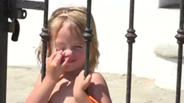 GRAND JUNCTION COLORADO-2017: Little Cute Girl Smiling While Holding On The Gate