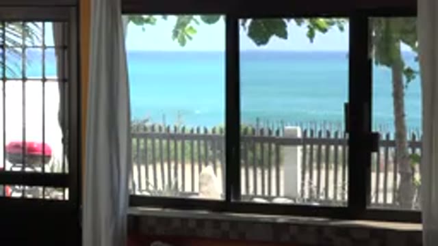 GRAND JUNCTION COLORADO-2017: Window Overlooking the Sea with Calm Picket Fence and BBQ