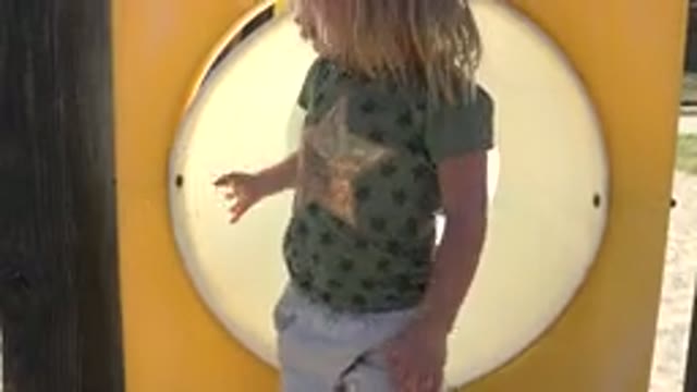 GRAND JUNCTION COLORADO-2017: Child Playing In The Playground Tunnel While