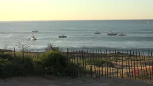 GRAND JUNCTION COLORADO-2017: Standing On A Dune Looking At The Boats In The Ocean