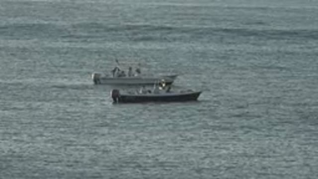 GRAND JUNCTION COLORADO-2017: Two Grey Boats In Water On A Clear Day