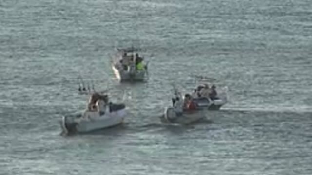 GRAND JUNCTION COLORADO-2017: People In Fishing Boats Out At Sea With Waves
