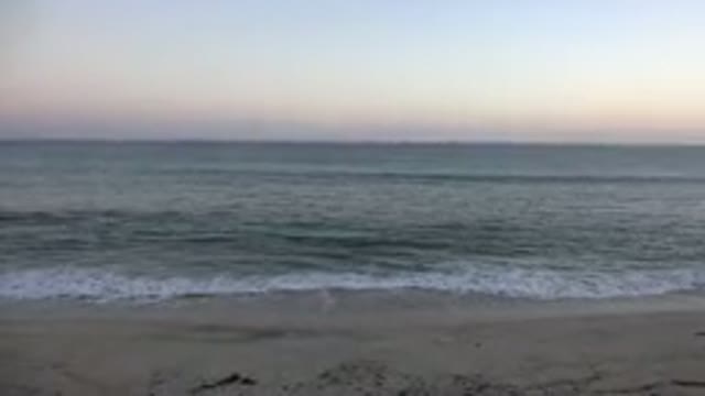GRAND JUNCTION COLORADO-2017: Relaxing Scene of a Beach With Calm Waves