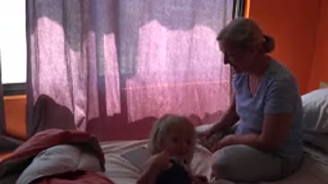 GRAND JUNCTION COLORADO-2017: Mom Playing With Her Daughter On A Tablet In A