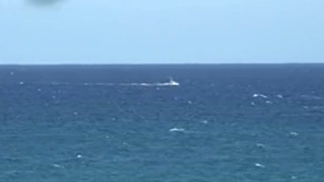 GRAND JUNCTION COLORADO-2017: A Boat Driving Very Fast In A Large Body Of Water