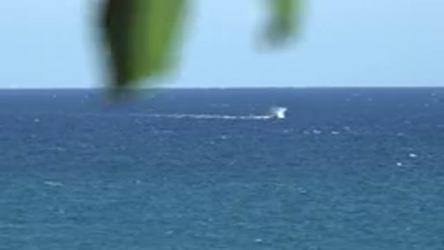 GRAND JUNCTION COLORADO-2017: Ocean On A Clear Day With Boat Going By