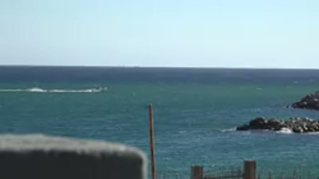 GRAND JUNCTION COLORADO-2017: Ocean From Shore With Boat Going Across The Frame
