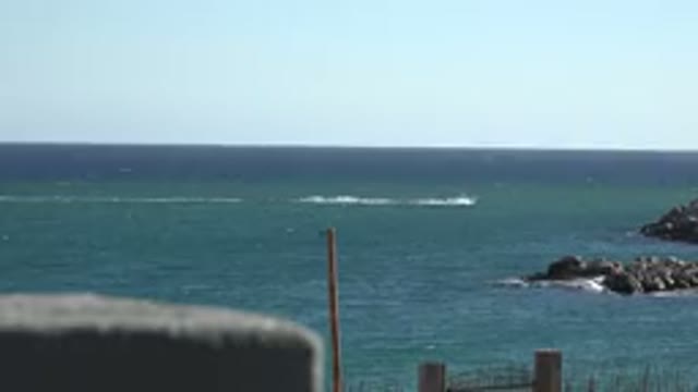 GRAND JUNCTION COLORADO-2017: Ocean Taken From The Shore While A Boat Crosses