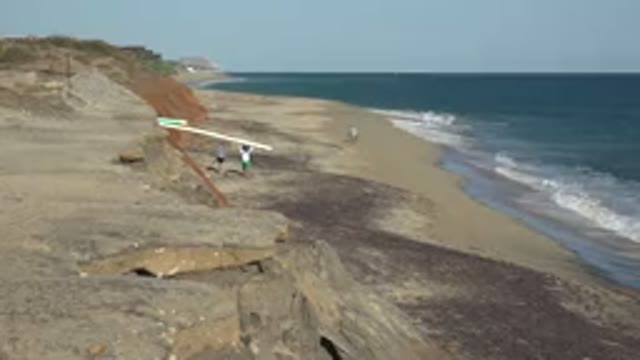 GRAND JUNCTION COLORADO-2017: People Walking On The Shore Of The Beach At A