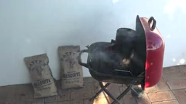 GRAND JUNCTION COLORADO-2017: A Grill Heating And Steaming With Coal Bags