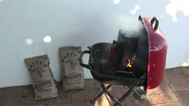 GRAND JUNCTION COLORADO-2017: A Charcoal Grill Getting the Charcoals Hot in a Chimney Starter