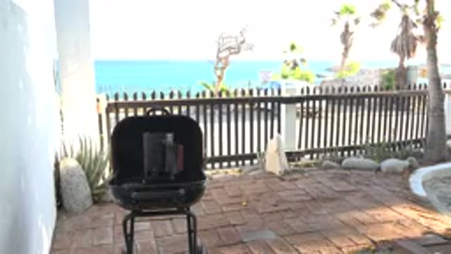 GRAND JUNCTION COLORADO-2017: Ocean View From A Brick Patio With Grill And Fence