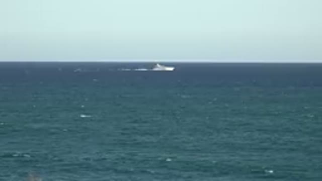 GRAND JUNCTION COLORADO-2017: A White Passenger Ship Travels On A Deep Blue Sea