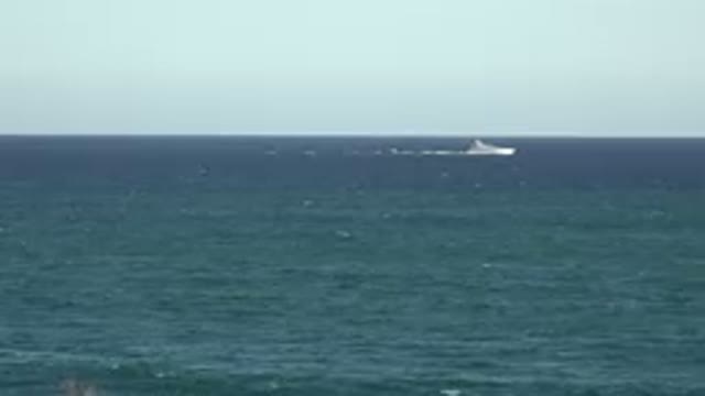 GRAND JUNCTION COLORADO-2017: A Boat Going Across The Frame With Ocean And Sky
