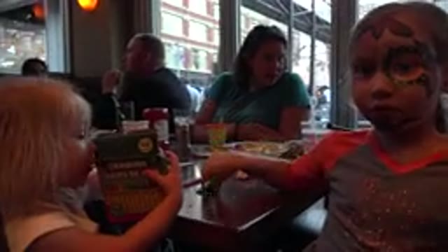 DENVER COLORADO-2016: Parents And Children Sitting At Table For A Birthday Party