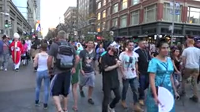DENVER COLORADO-2016: Crowded Street At A Carnival With People In Disguise