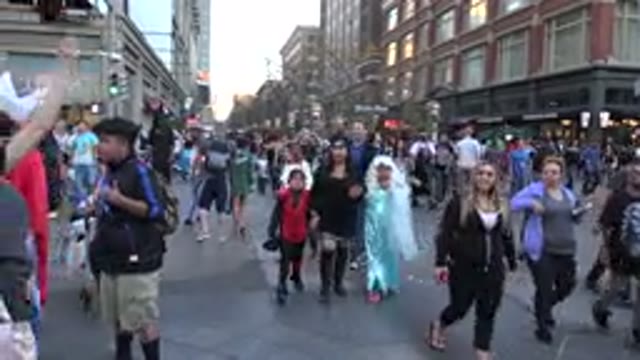 DENVER COLORADO-2016: Crowds Walking Through Streets On A Clear Day