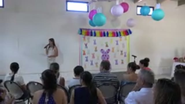 CABO SAN LUCAS MEXICO-2019: Teacher Speaks Into The Microphone To Parents During School Easter Performance