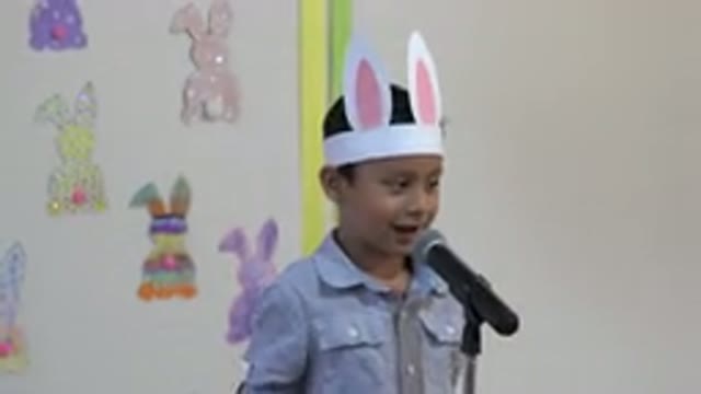 CABO SAN LUCAS MEXICO-2019: Little Boy Gives A Peach On Easter Looking Like A
