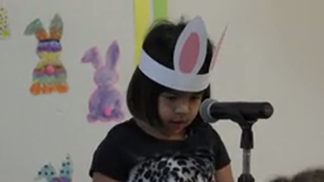 CABO SAN LUCAS MEXICO-2019: Little Girl With Easter Bunny Ears Hat Talking On
