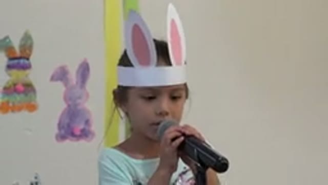 CABO SAN LUCAS MEXICO-2019: Little Girl With Bunny Paper Ears Talks
