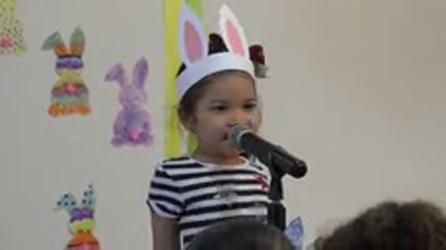 CABO SAN LUCAS MEXICO-2019: Little Shy Girl With Bunny Paper Ears Introduces Guests
