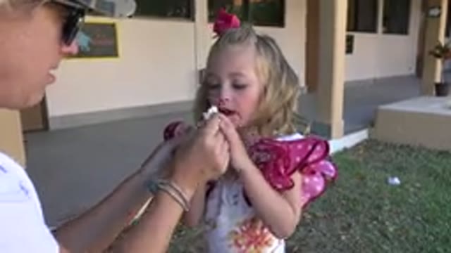CABO SAN LUCAS MEXICO-2019: A Young Blonde Child Getting Her Nose Wiped By A Woman