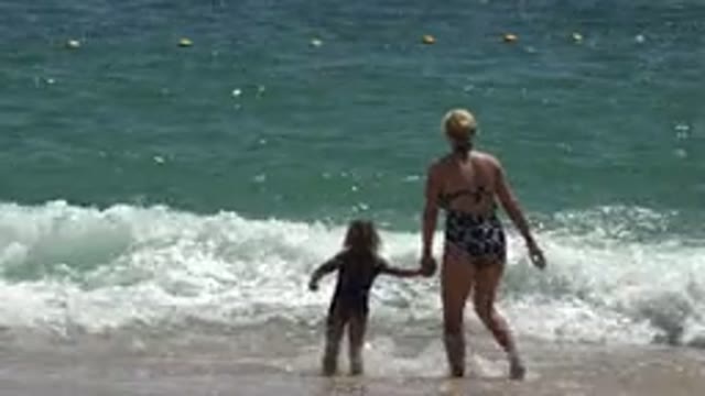 CABO SAN LUCAS MEXICO-2019: Beach On A Sunny Day With Rocks Sand Sea Blue Sky