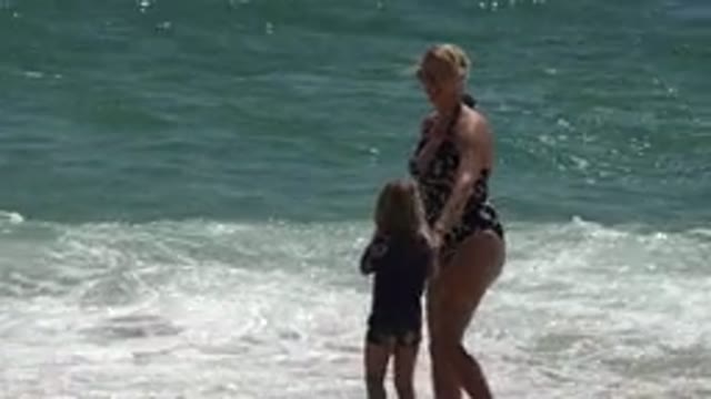 CABO SAN LUCAS MEXICO-2019: Mother and Child at Ocean Beach
