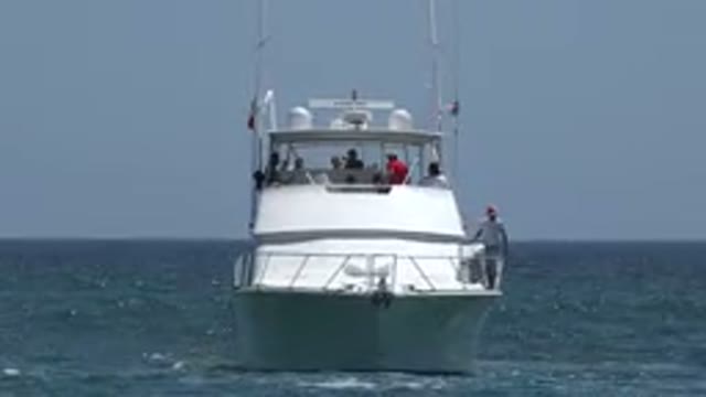 CABO SAN LUCAS MEXICO-2019: People Riding On White Yacht On A Bright Sunny Day