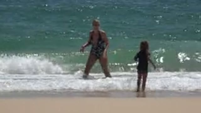 CABO SAN LUCAS MEXICO-2019: Mom And Her Son Playing On The Beach