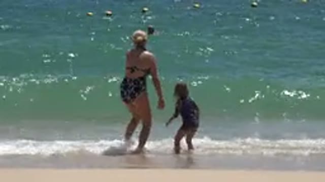 CABO SAN LUCAS MEXICO-2019: Mother And Daughter Having Fun Smashing The Waves