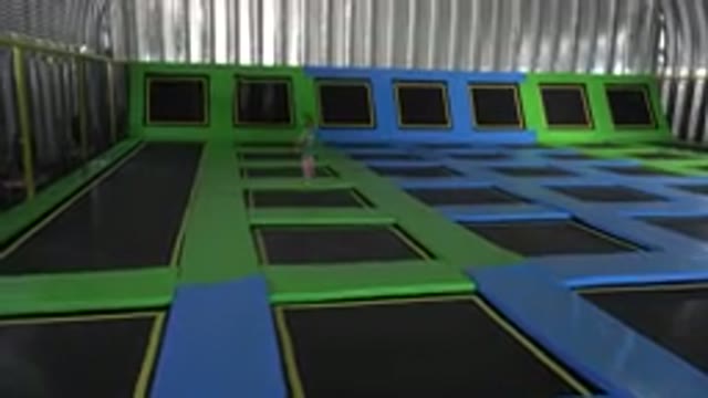 CABO SAN LUCAS MEXICO-2019: Happy Little Girl Jumping Inside Indoor Trampoline Park