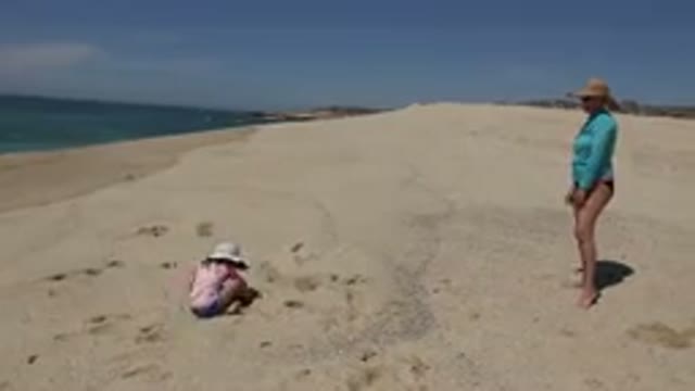 CABO SAN LUCAS MEXICO-2019: Mother And Daughter Having Fun Playing Chase On A
