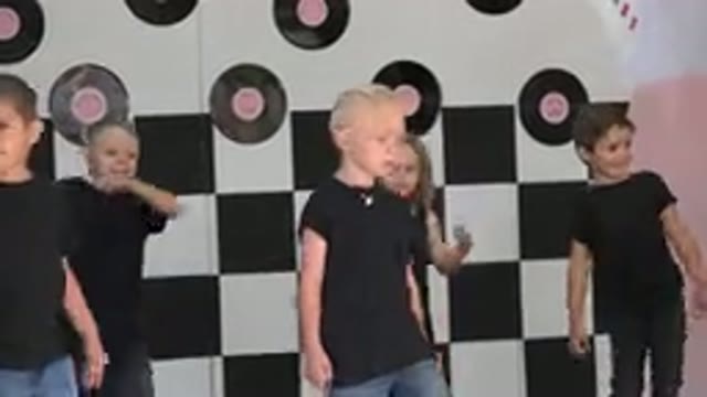 CABO SAN LUCAS MEXICO-2019: Little Kids Wearing Black Shirts Happily Sliding To
