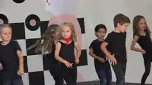 CABO SAN LUCAS MEXICO-2019: A Group Of Children Are Dancing Together Along A