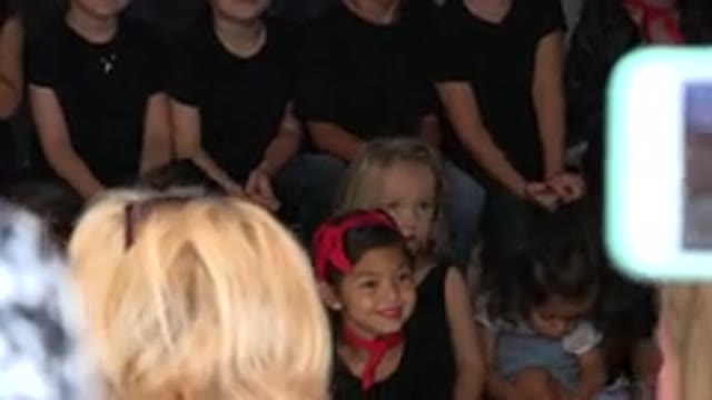 CABO SAN LUCAS MEXICO-2019: Kids Wearing Black Shirts And Blue Jeans Sitting In