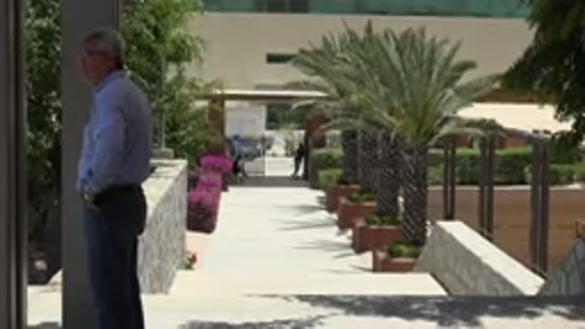 CABO SAN LUCAS MEXICO-2019: A Man Stands On A Walkway In Front Of A Building