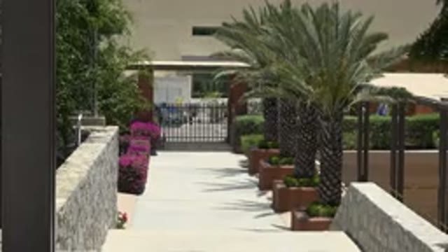CABO SAN LUCAS MEXICO-2019: A Walkway In Front Of A Building With Plants
